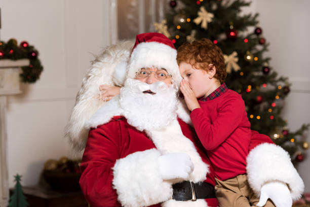 istock santa claus and little boy 865907526