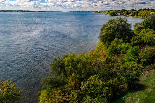 istock St. Lawrence River, coastline and blue sky, with sunlit clouds 865907640