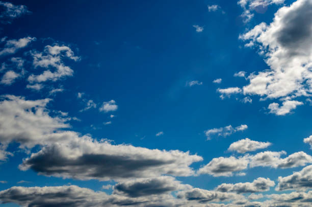 istock Blue Sky filled with bright clouds, backlit by the sun 865907784