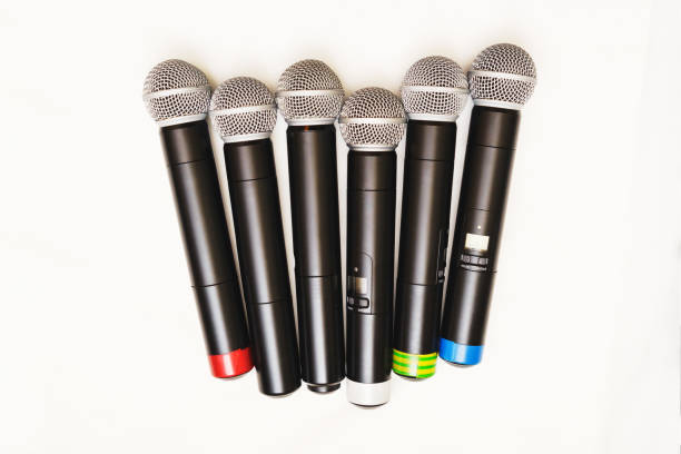istock Top view of six black wireless professional microphones. 865910670