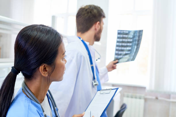 istock Beginning intern listening to doctors diagnose 865920326