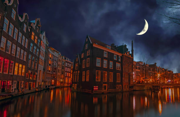 istock City scenic in Amsterdam the Netherlands at night by half moon 865923610
