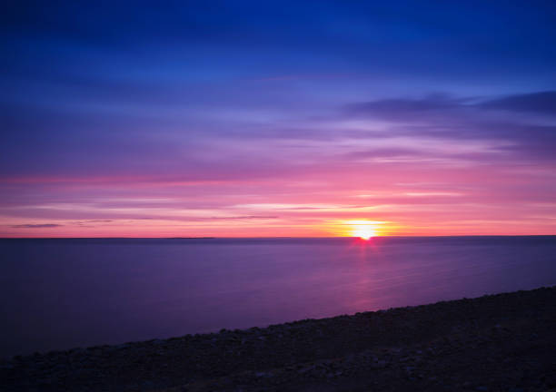 istock Horizontal vivid vibrant Baltic sunset horizon background backdr 865924404