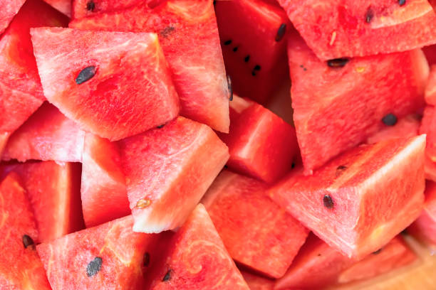 istock Sliced red ripe watermelon. Fruit background and texture 865935176