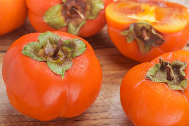 istock Fresh ripe persimmon with water drops. Selective focus 865952322