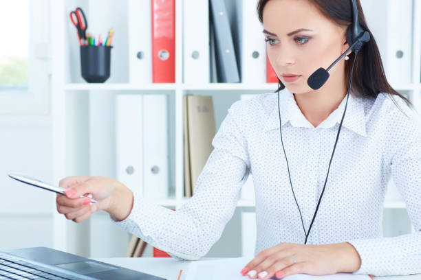 istock Portrait of happy smiling female customer support phone operator at workplace. 865952488