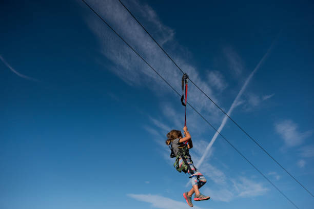istock Beautiful sky and zip lining child 865956206