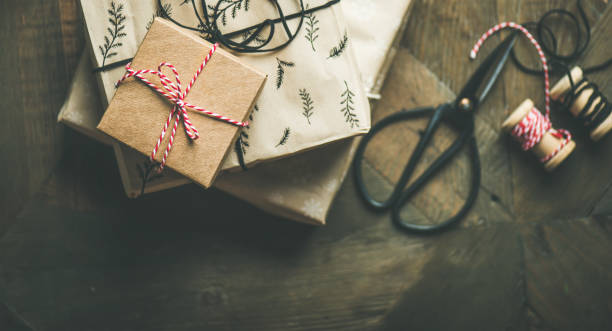 istock Flat-lay of holiday gift boxes, rope, scissors, copy space 865956262