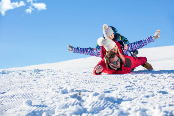 istock Ski, snow sun and fun - happy family on ski holiday 865959708