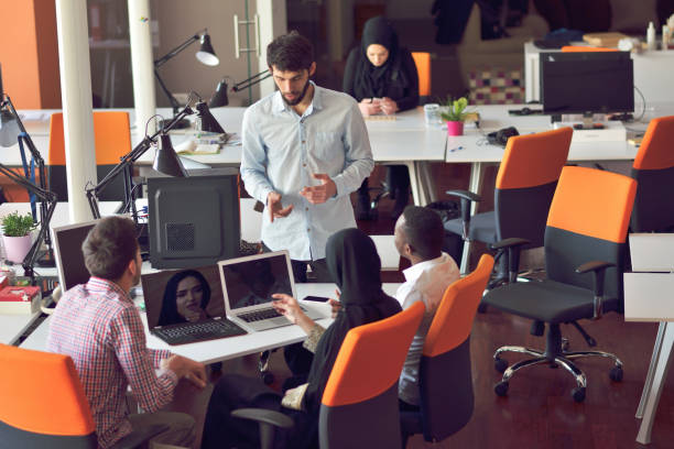 istock Multiracial contemporary business people working connected with technological devices like tablet and laptop 865961788