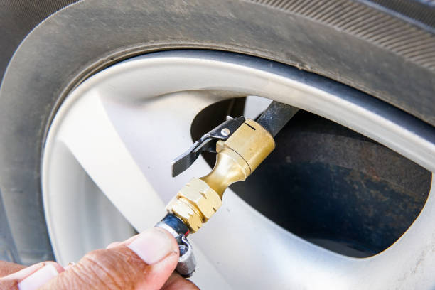 istock Pumping air filling air into a car tire. 865965768