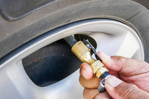 istock Pumping air filling air into a car tire. 865965808