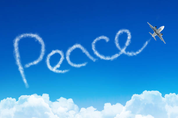istock Peace - inscription in the sky left by airplane. 865966002