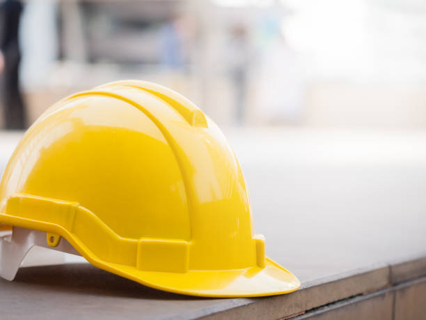 istock Yellow helmet on the floor 865967494