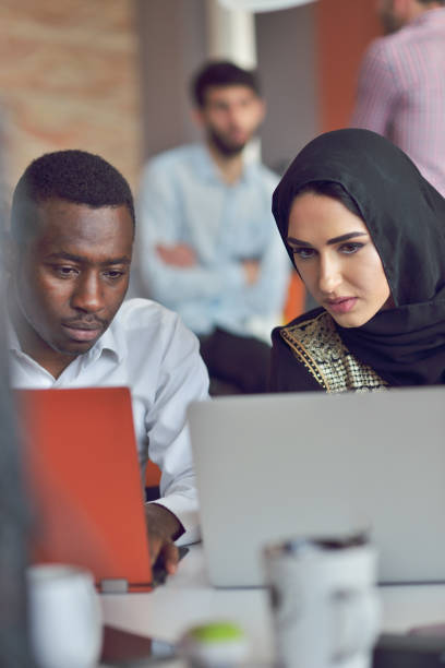 istock Multiracial contemporary business people working connected with technological devices like tablet and laptop 865969838