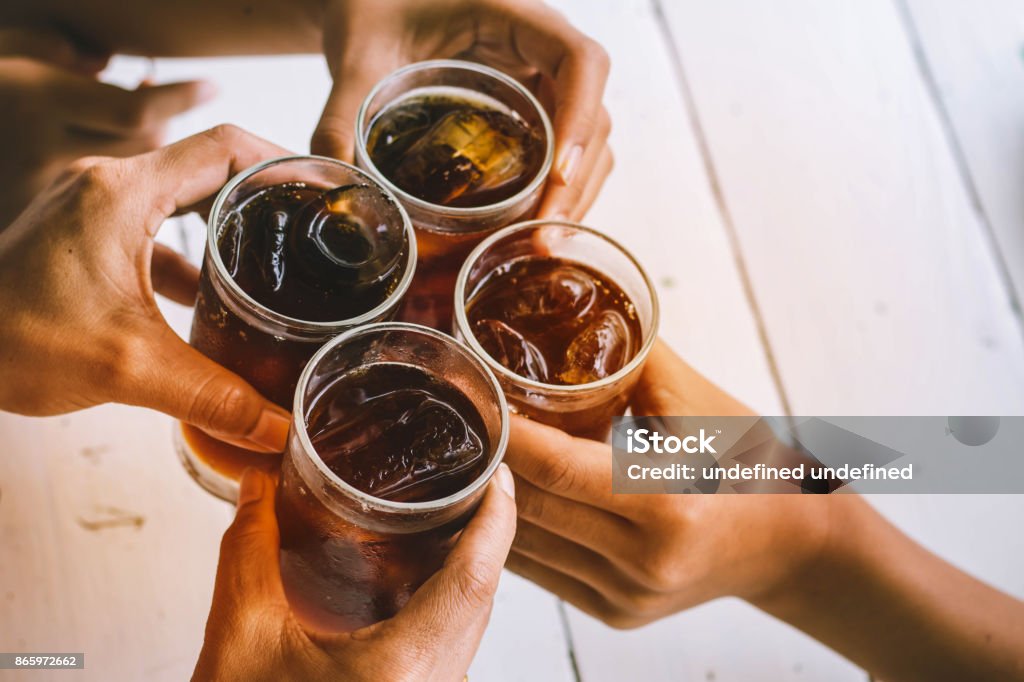 party people drinking soft drink,beverage, black water,for party,meeting,with fun and happy. Cola Stock Photo