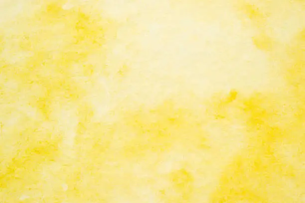 Photo of Yellow abstract watercolor painting textured on white paper background