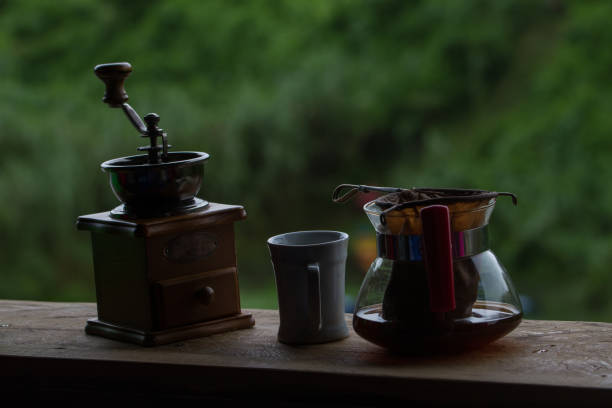 istock Coffee grinder with black coffee on wooden 865980090