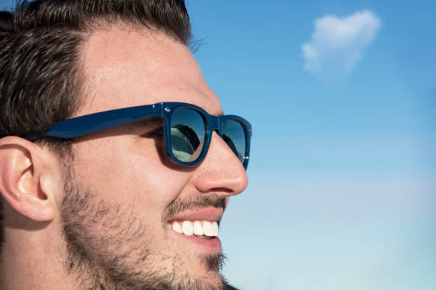 istock Male portrait on blue sky background on winter 865983288