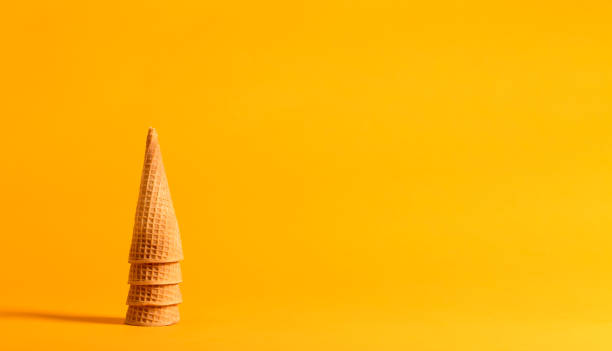 istock Ice cream cones on a yellow background 865990188