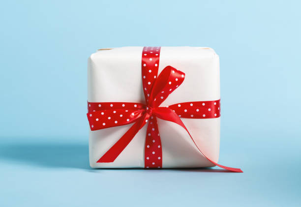 istock Gift box with miniature Christmas trees 865990278