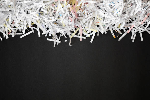 Shredded documents Shredded documents over black background shredded stock pictures, royalty-free photos & images