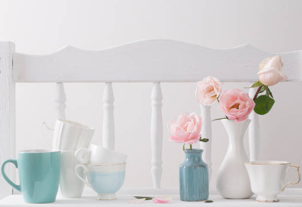 istock pink roses on vintage wooden white shelf 866001392