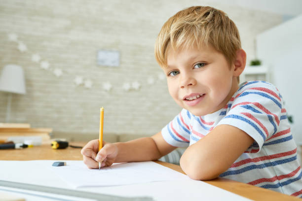 istock Good Little Boy Studying at Home 866007370