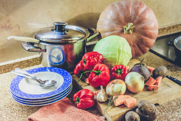 istock Set of vegetables plates and saucepan 866010164