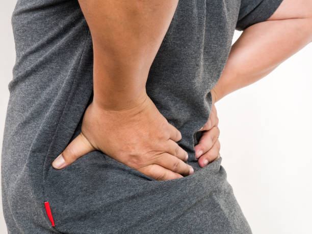 istock Middle-aged man with back pain on white background, healthy concept. 866011778