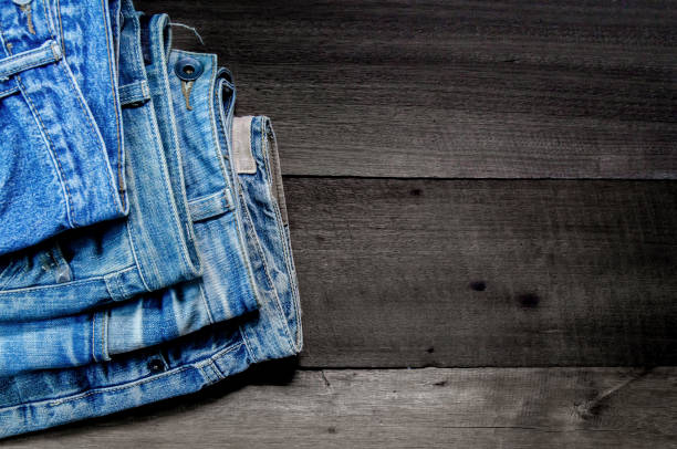 istock Blue jean and jean lack texture on the wooden floor 866021864
