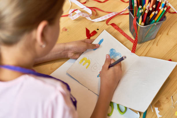 istock Girl Making Handmade Card for Mom 866028650