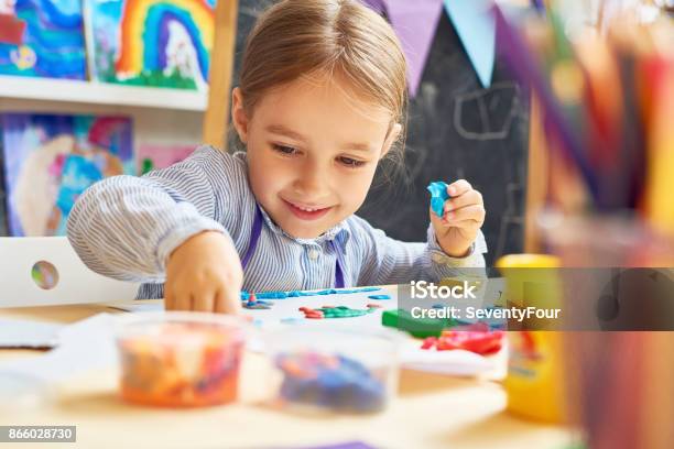 Happy Little Girl In Development School Stock Photo - Download Image Now - Child, Playing, Education