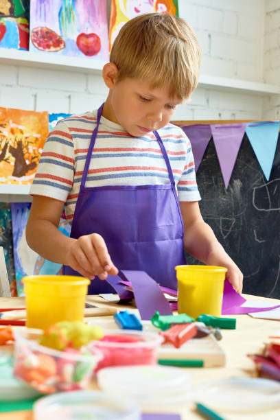 istock Little Boy in Art and Craft Class 866028740