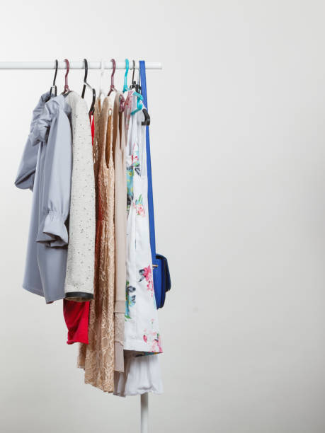 istock Clothes on hangers in closet 866031852