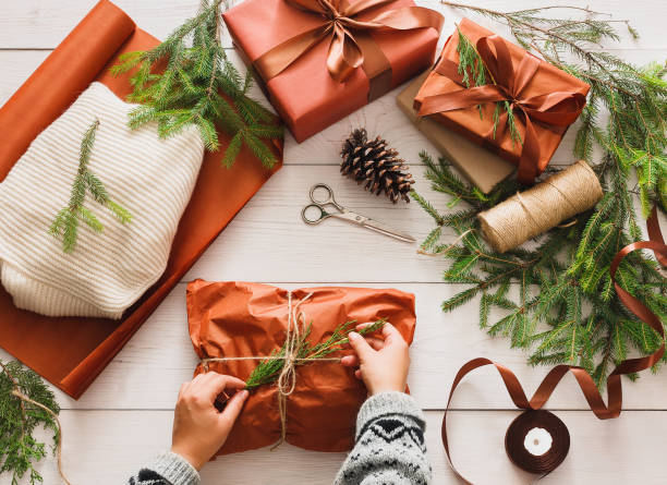 istock Wrapping christmas present gift on white wood background 866034824