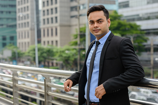 Portrait of young Indian businessman around the city of Bangkok Thailand