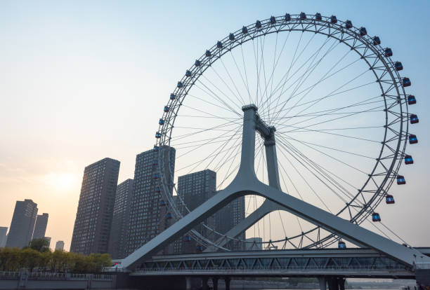 istock big ferris wheel against sky 866036540