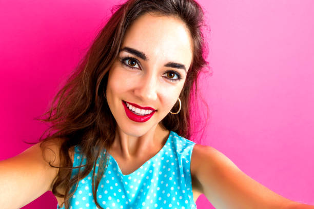 istock Young woman taking a selfie 866039160