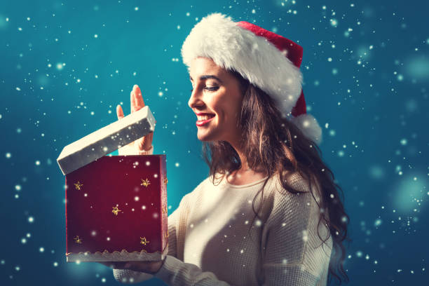istock Happy young woman with Christmas present box 866039682