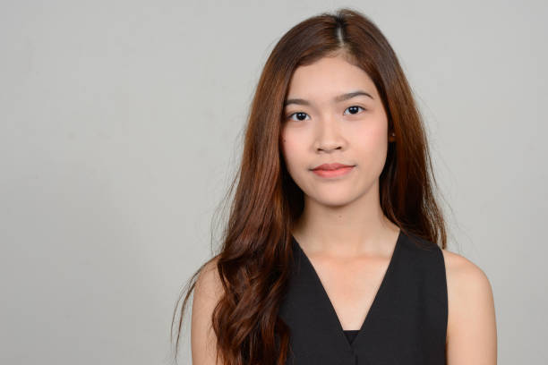 istock Young beautiful Asian woman against white background 866040434