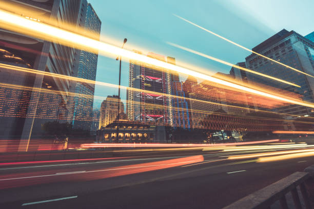 istock traffic trails in downtown hong kong 866040686
