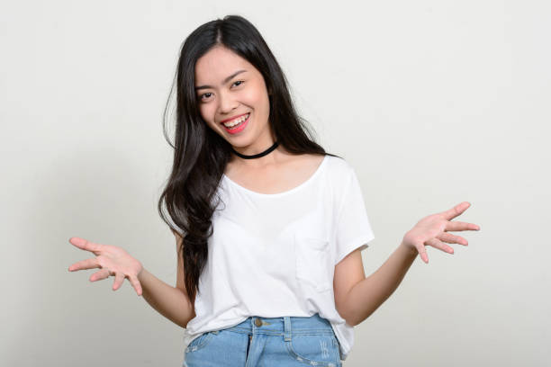 istock Young beautiful Asian woman against white background 866040886