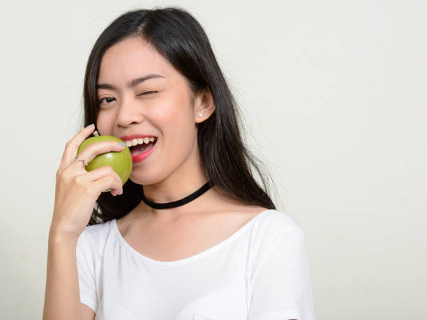 istock Young beautiful Asian woman against white background 866043018