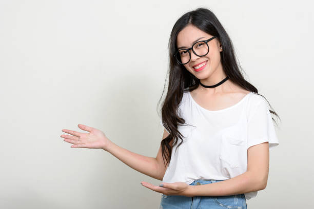 istock Young beautiful Asian woman against white background 866043090