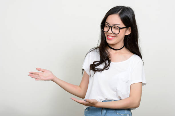 istock Young beautiful Asian woman against white background 866043098