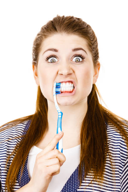 istock Woman brushing cleaning teeth. 866044170