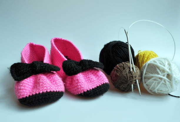 istock pink knitted slippers for girls 866048770