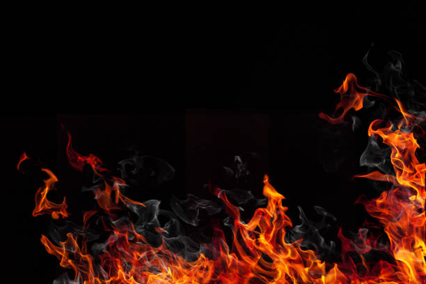 istock Real fire flames and smoke isolated on black 866049576
