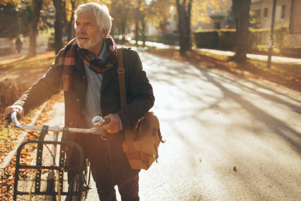 istock Stylish, senior man on a bicycle 866051754